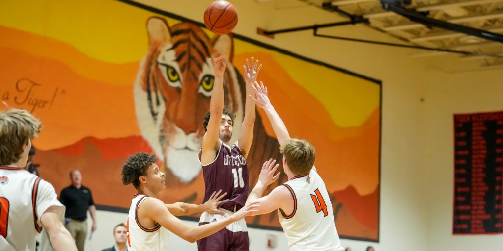 Littleton lights it up from three, cruises to win